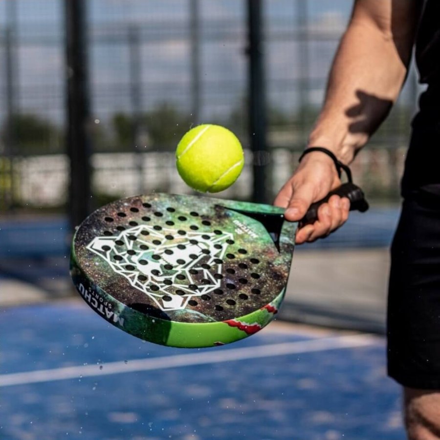A player bouncing a ball on the Bear racket