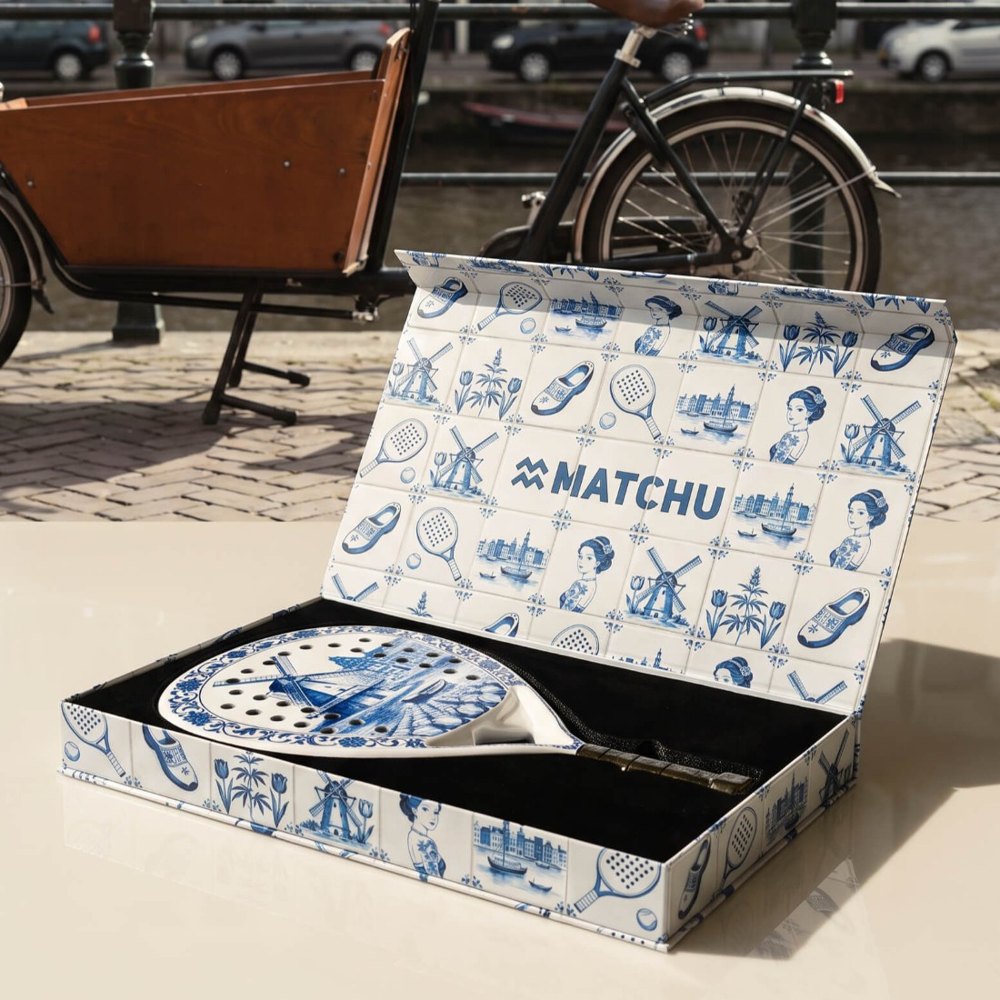 The open Delft Blue box on a car by an Amsterdam canal