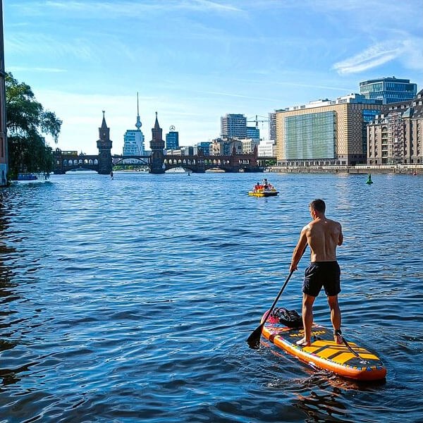 Paddling a MATCHU board on a river in the city